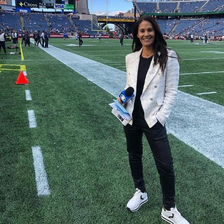 Tracy Wolfson posing for a photo shoot for her Instagram feed. 